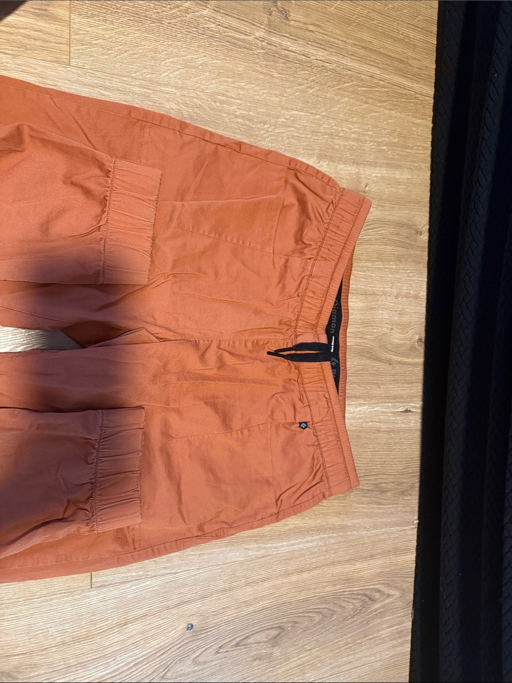 Black Diamond women’s Rust Orange Track Joggers for rock climbing